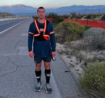 Ultra-runner Andrew Linder wearing a 15-pound weighted vest and OS1st's Wicked Comfort® Socks during his cross-country run against human trafficking.