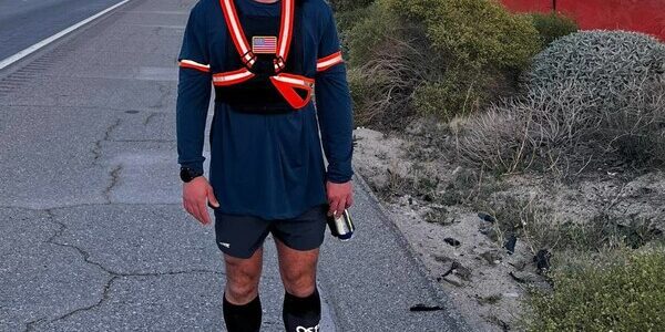 Ultra-runner Andrew Linder wearing a 15-pound weighted vest and OS1st's Wicked Comfort® Socks during his cross-country run against human trafficking.