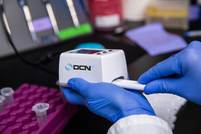 DCN Dx showcasing miniDxR lateral flow reader at NextGen Dx Summit 2024